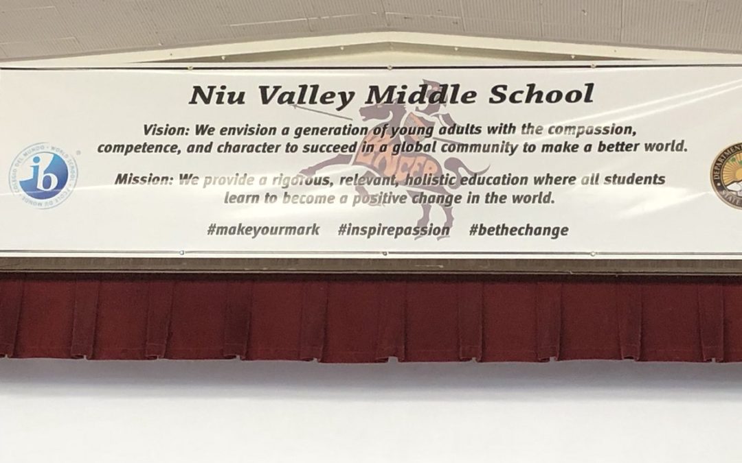 White banner of Niu Valley Middle School Vision and Mission