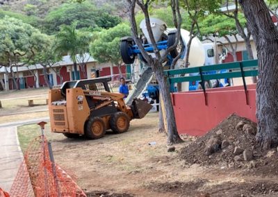 Truck delivers cement for trench in courtyard