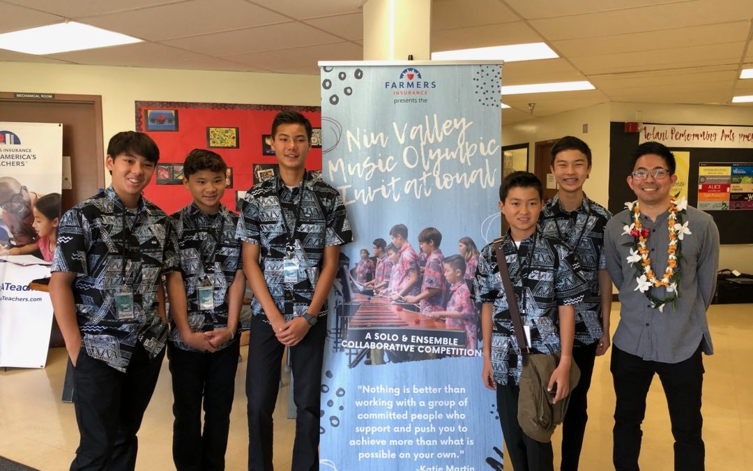 NVMS Music Olympic Competition - 5 students with teacher next to banner