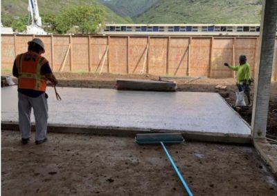 Construction Site - World Language Center, cement slab and 2 construction workers