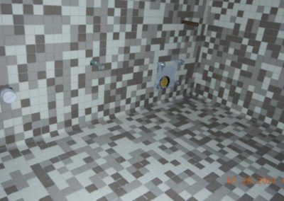 Wall tilework in unfinished bathroom
