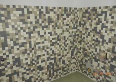 Wall tilework in unfinished bathroom